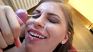 Hot teen smiles while face gets covered in cum