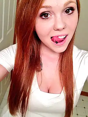 Sexy girl with pierced tongue